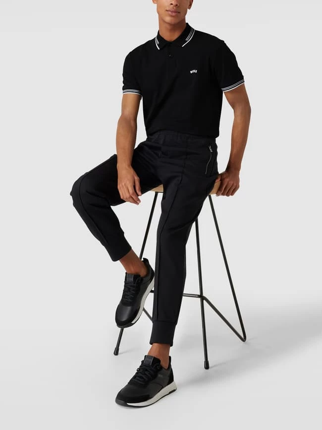 BOSS Athleisurewear Slim Fit Poloshirt Mit Kontraststreifen Modell 'Paul Curved' - Schwarz 1 BOSS Athleisurewear Slim Fit Poloshirt Mit Kontraststreifen Modell 'Paul Curved' - Schwarz